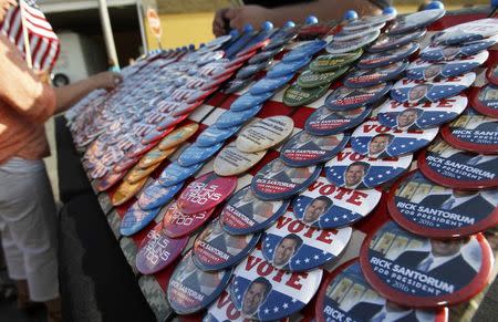 Republican presidential candidate and former U.S. Senator Rick Santorum's campaign buttons are seen before Santorum formally declared his candidacy for the 2016 Republican presidential nomination during an announcement event in Cabot, Pennsylvania, May 27, 2015. REUTERS/Aaron Josefczyk