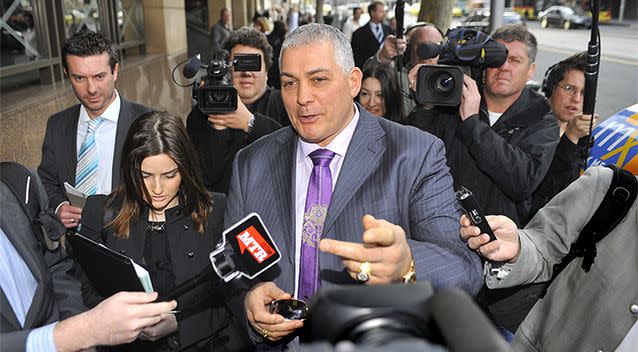 Gangland figure Mick Gatto leaves the Melbourne Magistrates Court surrounded by media in Melbourne, Tuesday, July 13, 2010. Photo: AAP