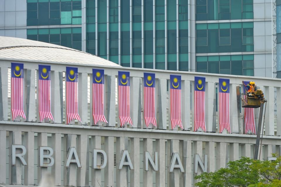 The Jalur Gemilang flags are seen on a building in Putrajaya ahead of Malaysia's 66th Merdeka celebration, August 23, 2023. — Picture by Shafwan Zaidon