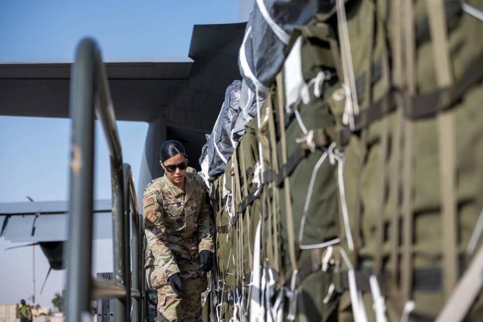 A US Air Force Airman prepares bundles of humanitarian aid destined for an airdrop over Gaza.