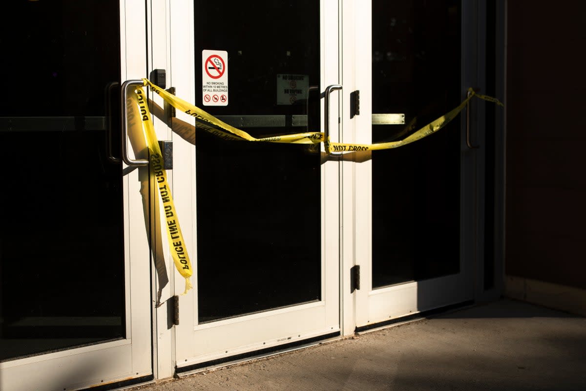 Police tape cordons off a door following a stabbing at the University of Waterloo, in Waterloo, Ontario, Wednesday, June 28, 2023. (AP)