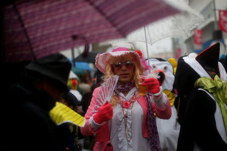 A carnival participant reacts during a parade in Torres Vedras, Portugal February 11, 2018. REUTERS/Pedro Nunes