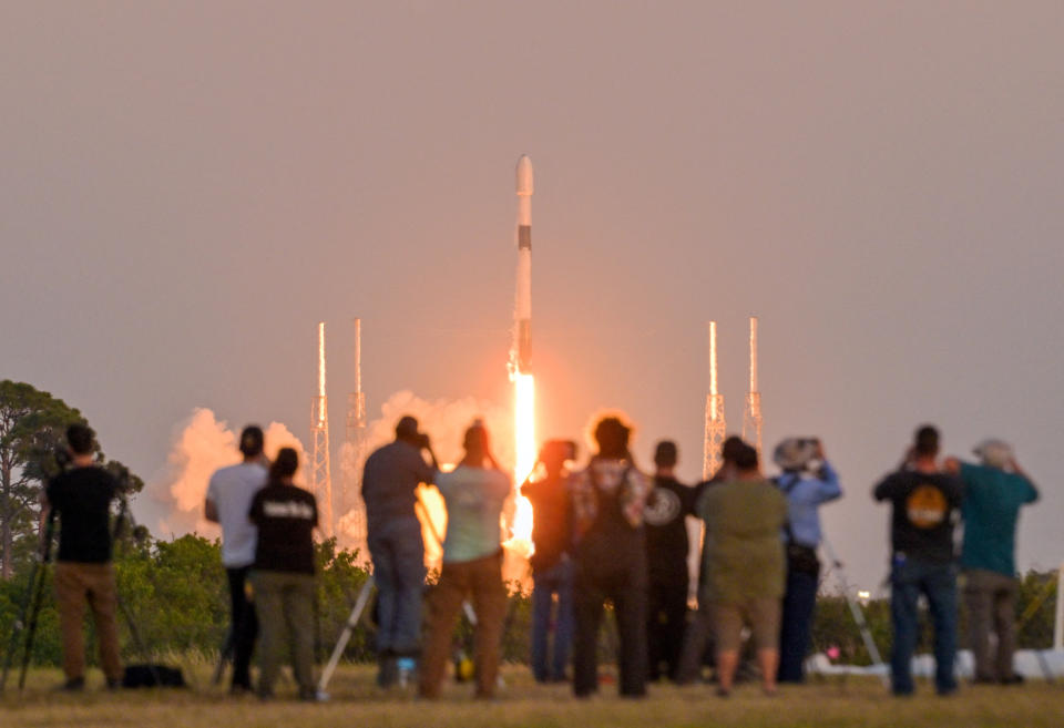 Spectators watch as a SpaceX Falcon 9 rocket lifts off with a payload of 21 Starlink satellites from the Cape Canaveral Space Force Station in Cape Canaveral, Florida, U.S., February 27, 2023. REUTERS/Steve Nesius