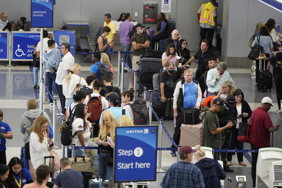 Travelers wait at the departure area check-in at the United Airlines terminal at Los Angeles International airport, Wednesday June 28, 2023, in Los Angeles. Travelers waited out widespread delays at U.S. airports on Tuesday, an ominous sign heading into the long July 4 holiday weekend, which is shaping up as the biggest test yet for airlines that are struggling to keep up with surging numbers of passengers. (AP Photo/Damian Dovarganes)