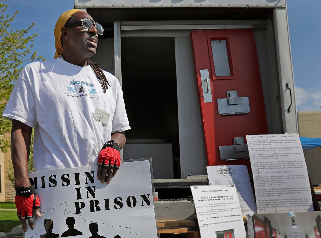 Talib Akbar, who travels with the cell, talks during a solitary confinement cell replica tour event on Thursday at St. Joseph Catholic Church in Appleton. The replica cell was part of an awareness event put on by ESTHER/WISDOM as part of their transformational justice campaign.