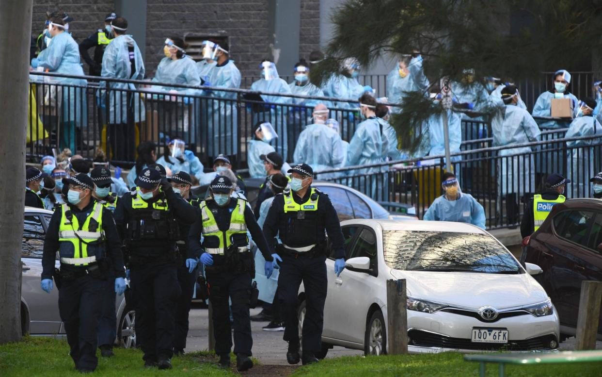 Public housing blocks under lockdown due to coronavirus outbreak in Melbourne, Australia - Shutterstock