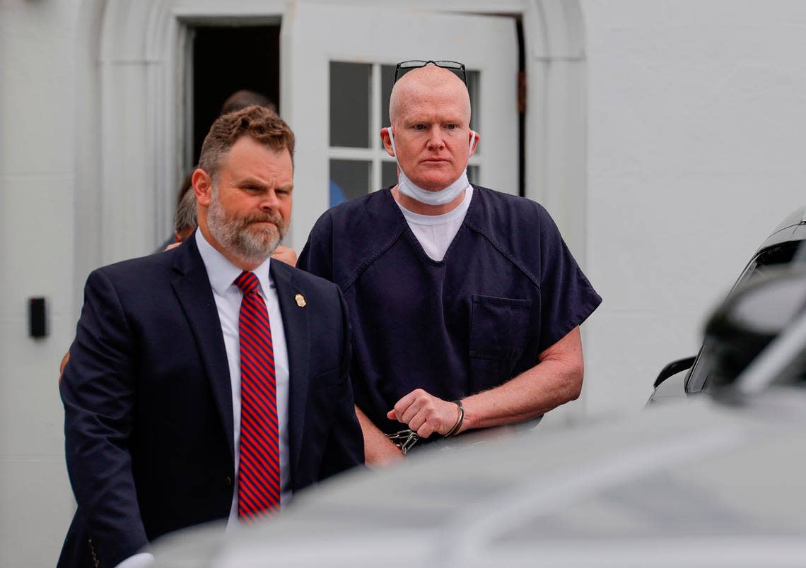 Alex Murdaugh is escorted from the Colleton County Courthouse after a judicial hearing before Judge Clifton Newman on Monday, Aug. 29, 2022.