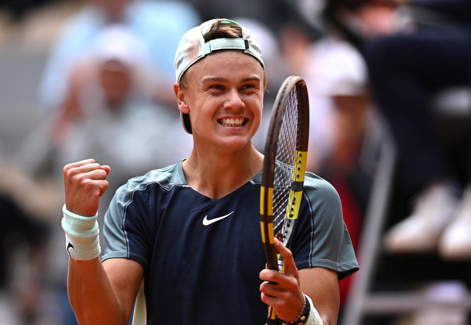 Tennis - French Open - Roland Garros, Paris, France - May 30, 2022  Denmark's Holger Rune celebrates winning his fourth round match against Greece's Stefanos Tsitsipas REUTERS/Dylan Martinez