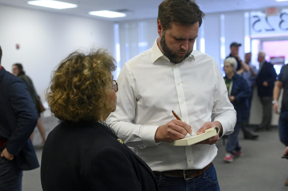 CANTON, OH - OCTOBER 13: US Republican Senate candidate for Ohio JD Vance signs his book Hillbilly Elegy for a supporter at a campaign office on October 13, 2022 in Canton, Ohio. According to a new Emerson College/The Hill Survey, Vance is locked in a dead heat with Democratic Representative Tim Ryan in this year's closely watched Ohio Senate race. (Photo by Jeff Swensen/Getty Images)