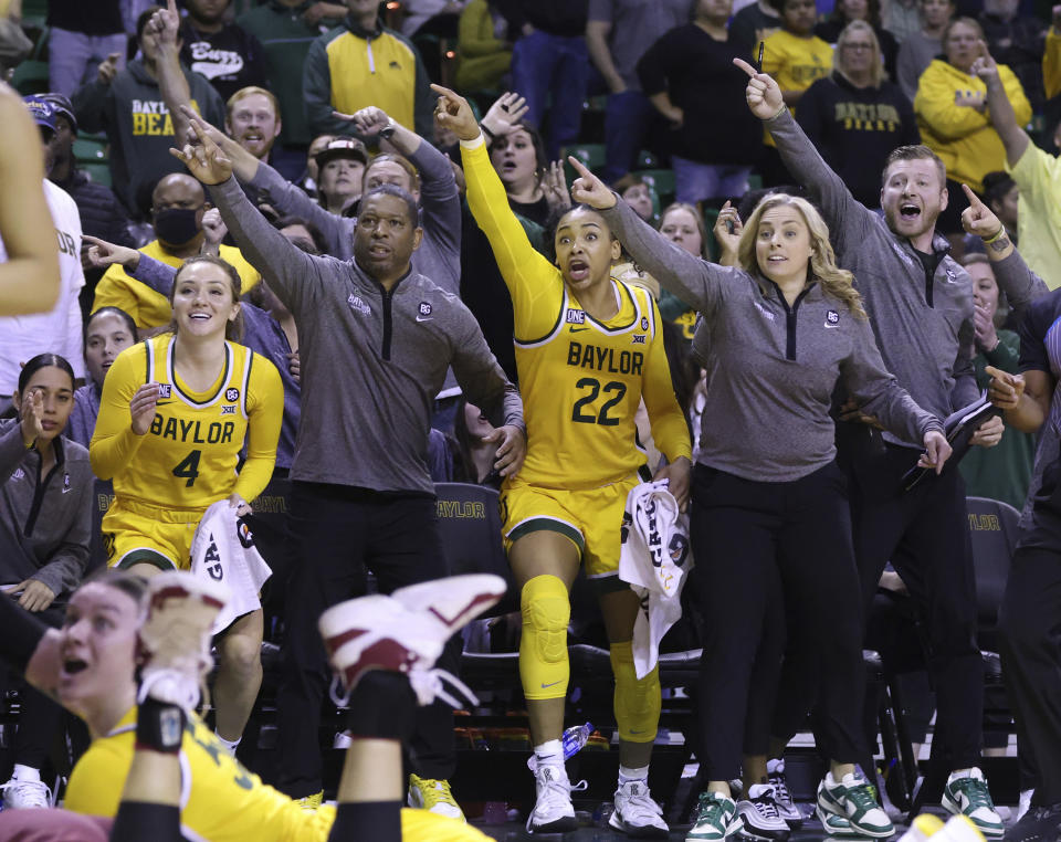 Baylor coach Nicki Collen, right, guard Bella Fontleroy (22) and guard Jana Van Gytenbeek (4) react to a turnover by Oklahoma during the second half of an NCAA college basketball game Tuesday, Feb. 7, 2023, in Waco, Texas. (Rod Aydelotte/Waco Tribune-Herald via AP)