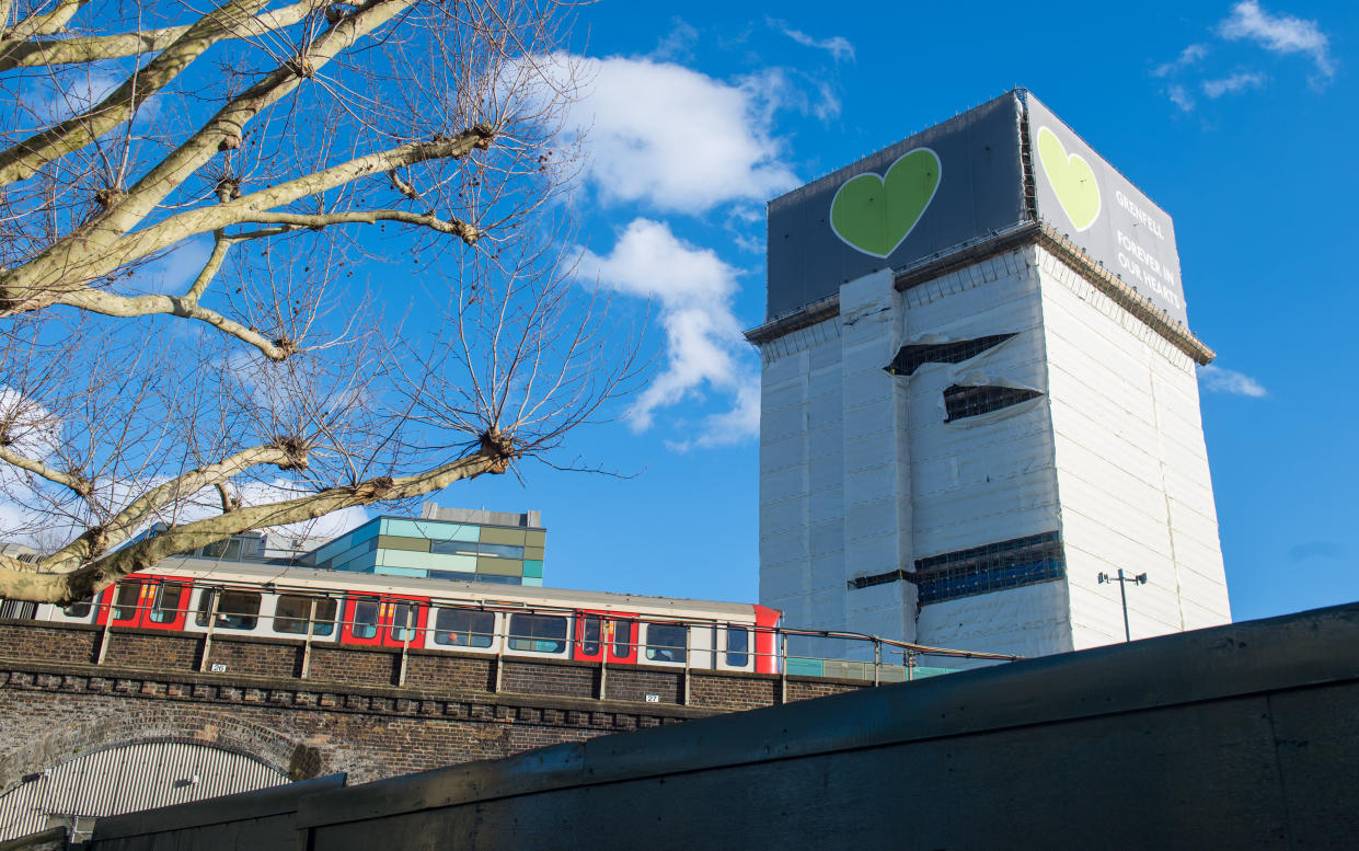 Grenfell Tower, in west London, after high winds damaged plastic sheeting covering the building. (Photo by Dominic Lipinski/PA Images via Getty Images)