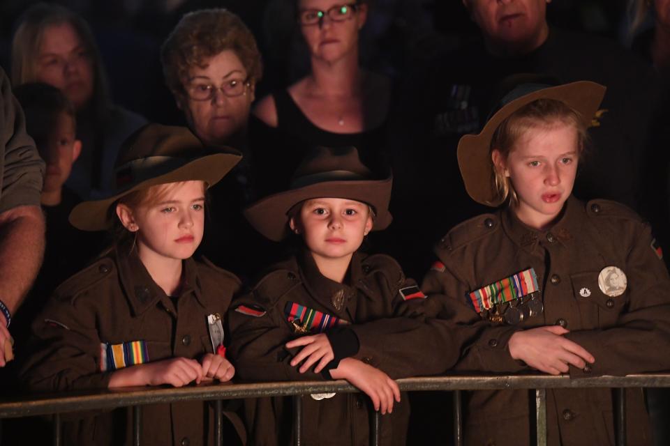 Crowds gather during the Dawn Service at the Shrine of Remembrance in Melbourne for Anzac Day 2019. Source: AAP