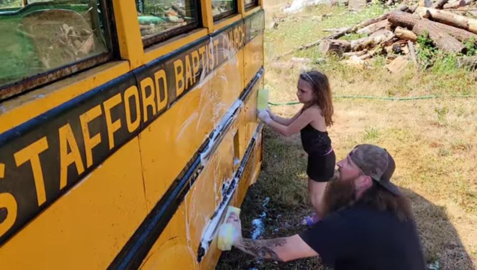 Jason and his daughter Skye were kept busy washing the bus (Collect/PA Real Life)