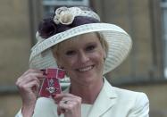 TV presenter and former tennis player Sue Barker holds her OBE after receiving it at Buckingham Palace, London, 22nd February 2000. (Photo by Colin Davey/Getty Images)