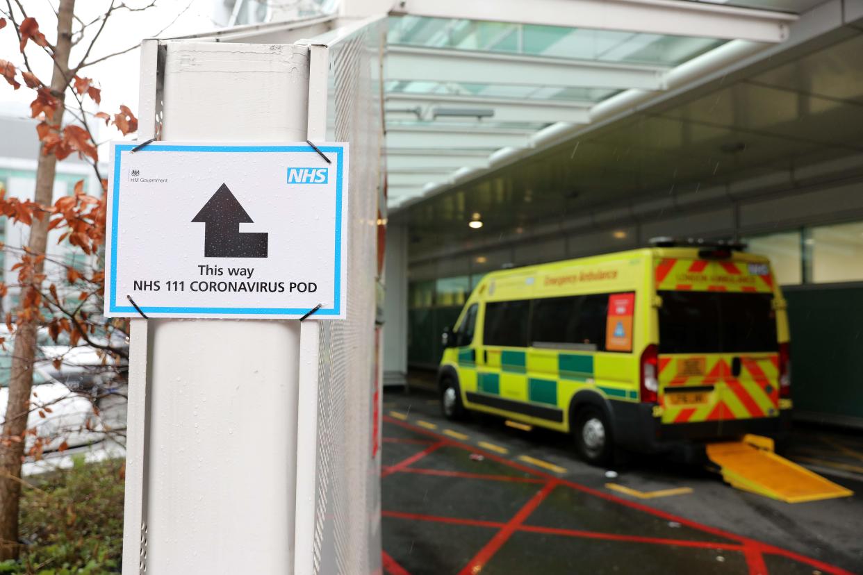 A sign directs patients towards an NHS 111 Coronavirus (COVID-19) Pod, where people who believe they may be suffering from the virus can attend and speak to doctors, is seen outside University College Hospital in London on March 5, 2020. - The number of confirmed cases of novel coronavirus COVID-19 in the UK rose to 90 on Thursday, with fears over the outbreak delaying the global release of the new James Bond movie and causing lack of demand for air travel that has proved the final nail in the coffin for British regional airline Flybe which went into administration on March 5. (Photo by ISABEL INFANTES / AFP) / The erroneous mention[s] appearing in the metadata of this photo by ISABEL INFANTES has been modified in AFP systems in the following manner: [University College] instead of [St Thomas']. Please immediately remove the erroneous mention[s] from all your online services and delete it (them) from your servers. If you have been authorized by AFP to distribute it (them) to third parties, please ensure that the same actions are carried out by them. Failure to promptly comply with these instructions will entail liability on your part for any continued or post notification usage. Therefore we thank you very much for all your attention and prompt action. We are sorry for the inconvenience this notification may cause and remain at your disposal for any further information you may require. (Photo by ISABEL INFANTES/AFP via Getty Images)