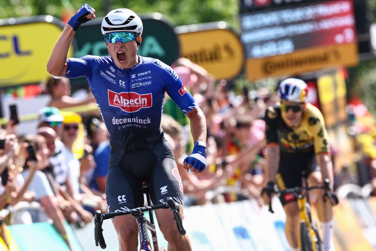 Jasper Philipsen celebrates victory on stage three of the Tour de France (AFP via Getty Images)