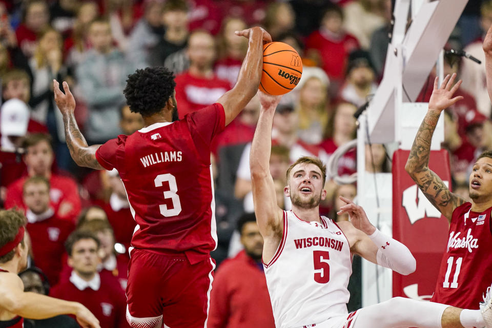 Nebraska's Brice Williams (3) blocks a pass by Wisconsin's Tyler Wahl (5) during the first half of an NCAA college basketball game Saturday, Jan. 6, 2024, in Madison, Wis. (AP Photo/Andy Manis)