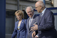 Britain's Prince Charles, center, listens to the head of Romania's Department for Emergency Situations (DSU) Raed Arafat, right, during a visit at a center for refugees fleeing the war in neighboring Ukraine, at the Romexpo convention center, in Bucharest, Romania, Wednesday, May 25, 2022.(AP Photo/Vadim Ghirda)