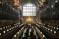 Princess Anne, Prince Charles, Prince Edward, Prince Andrew, Peter Phillips, Prince William, the Earl of Snowdon, Prince Harry and Tim Laurence, follow as the coffin is brought in Britain Prince Philip's funeral at St George's chapel in Windsor Castle, Windsor, England, Saturday April 17, 2021. Prince Philip died April 9 at the age of 99 after 73 years of marriage to Britain's Queen Elizabeth II. (Barnaby Fowler/Pool via AP)