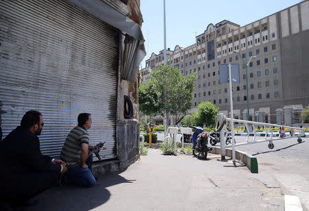 FILE PHOTO: Members of Iranian forces take position during an attack on the Iranian parliament in central Tehran, Iran June 7, 2017. Omid Vahabzadeh/TIMA via REUTERS/File Photo via REUTERS