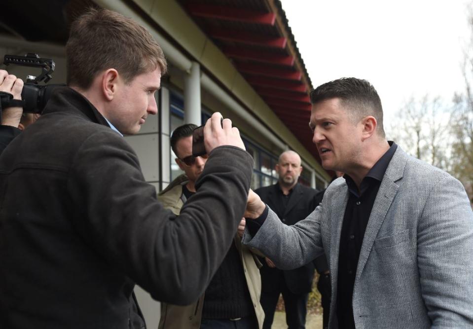 Tommy Robinson talking to the media as he arrives at Peterborough County Court in Cambridgeshire during a civil court case (PA)