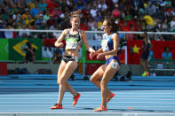 <p>Abbey D’Agostino of the United States (R) is assisted by Nikki Hamblin of New Zealand after a collision during the Women’s 5000m Round 1 – Heat 2 on Day 11 of the Rio 2016 Olympic Games at the Olympic Stadium on August 16, 2016 in Rio de Janeiro, Brazil. (Photo by Ian Walton/Getty Images) </p>