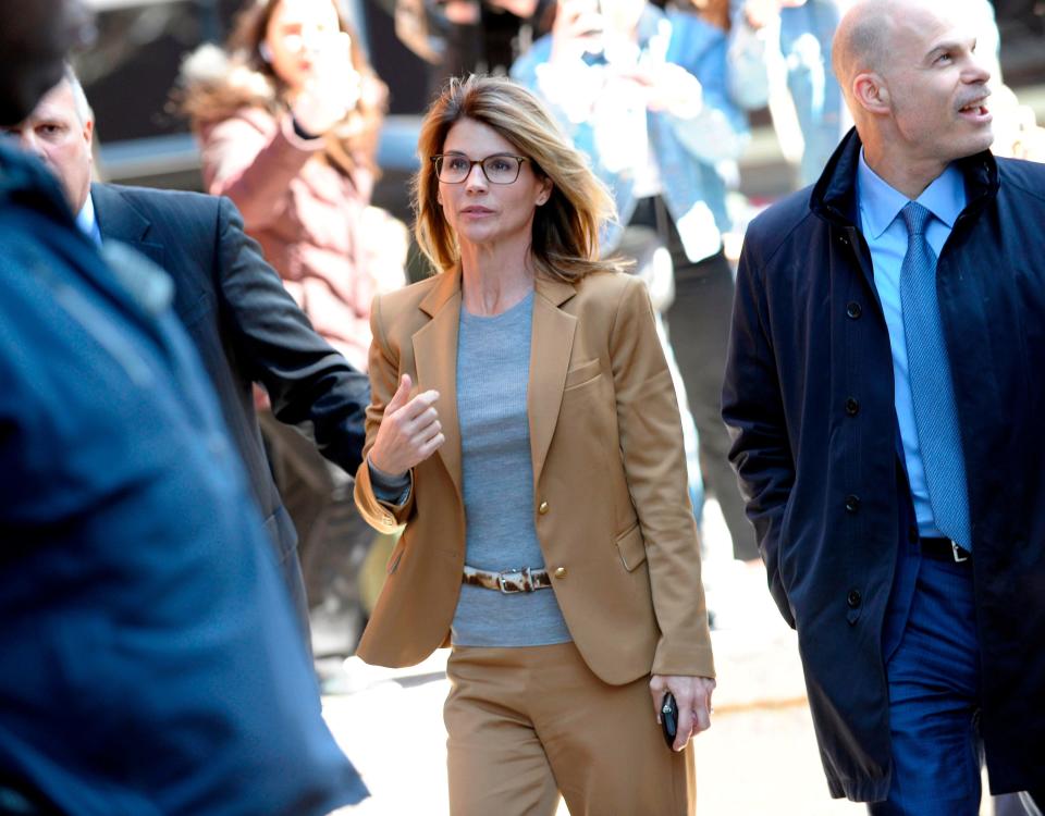 Actress Lori Loughlin arrives at court to face charges in the college admissions scandal in Boston, on April 3, 2019.