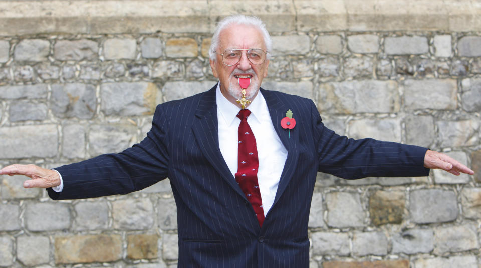Bernard Cribbins poses with his Officer of the British Empire (OBE) medal after receiving it during an Investiture ceremony with the Princess Anne, Princess Royal at Windsor Castle, on November 03, 2011 in Windsor, England. (Photo by Chris Ison - WPA Pool/Getty Images)