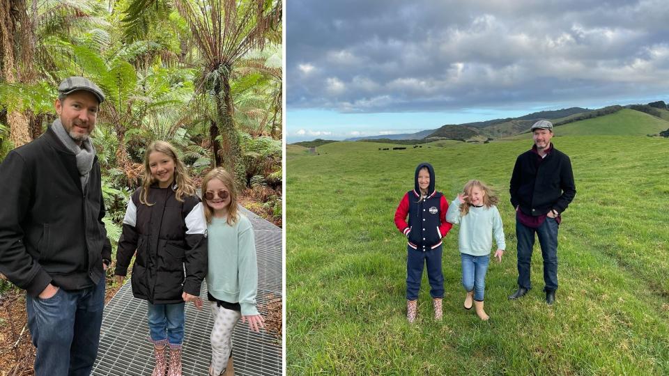 Owain Emslie with his two daughters in a rainforest, on a moor. 