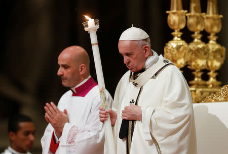 Pope Francis leads the Easter vigil Mass in Saint Peter's Basilica at the Vatican, April 20, 2019. REUTERS/Remo Casilli
