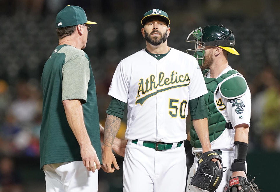 OAKLAND, CA - AUGUST 15:  Manager Bob Melvin #6 of the Oakland Athletics takes the ball from pitcher Mike Fiers #50 taking Fiers out of the game against the Houston Astros in the top of the seventh inning at Ring Central Coliseum on August 15, 2019 in Oakland, California.  (Photo by Thearon W. Henderson/Getty Images)