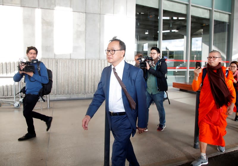 Cambodia's self-exiled opposition party founder Sam Rainsy, who has vowed to return to his home country, leaves after being prevented from checking-in for a flight from Paris to Bangkok at Roissy Airport in Paris