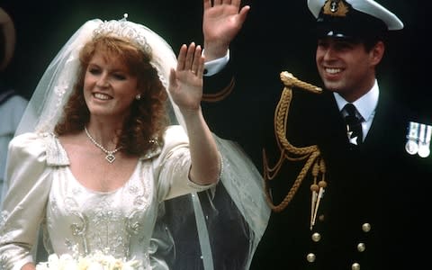 Prince Andrew and his bride Sarah Ferguson waving to crowds as they leave Westminster Abbey, London - Credit: PA