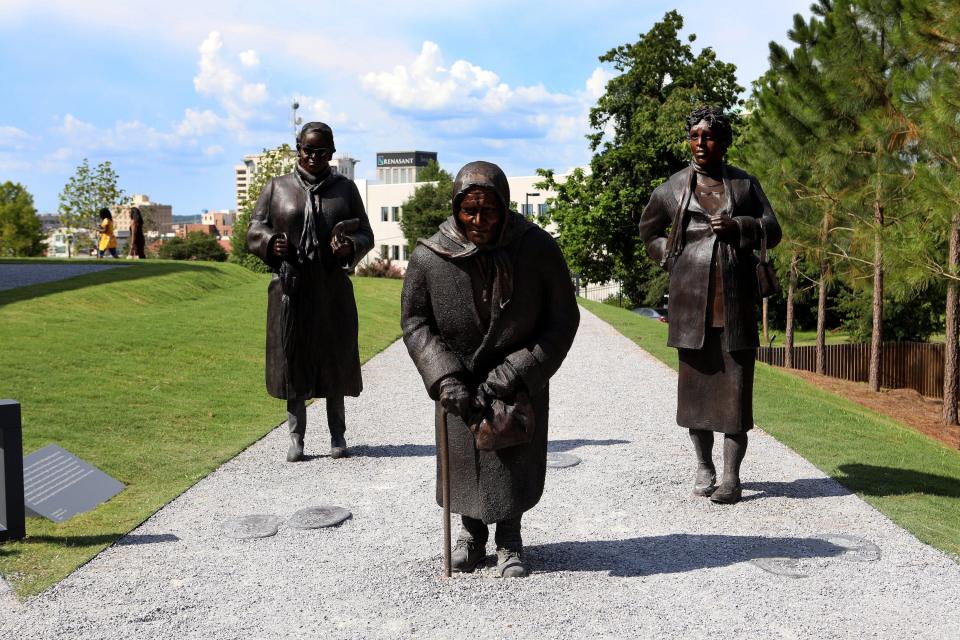Dana King's 'Guided By Justice' statue, dedicated to black women who sustained the Montgomery Bus Boycott and collectively walked thousands of miles, stands inside The National Memorial For Peace And Justice in Montgomery, Alabama.