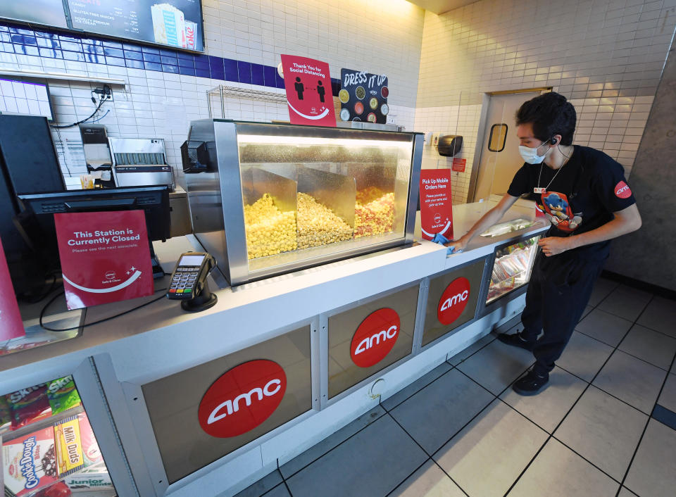 Joey Walsh sanitizes the concession stand at AMC Town Square 18 on August 20, 2020 in Las Vegas, Nevada. 