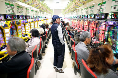 Visitors play pachinko, a Japanese form of legal gambling, at a pachinko parlour in Fukushima, Japan, May 24, 2018. Picture taken May 24, 2018. REUTERS/Issei Kato