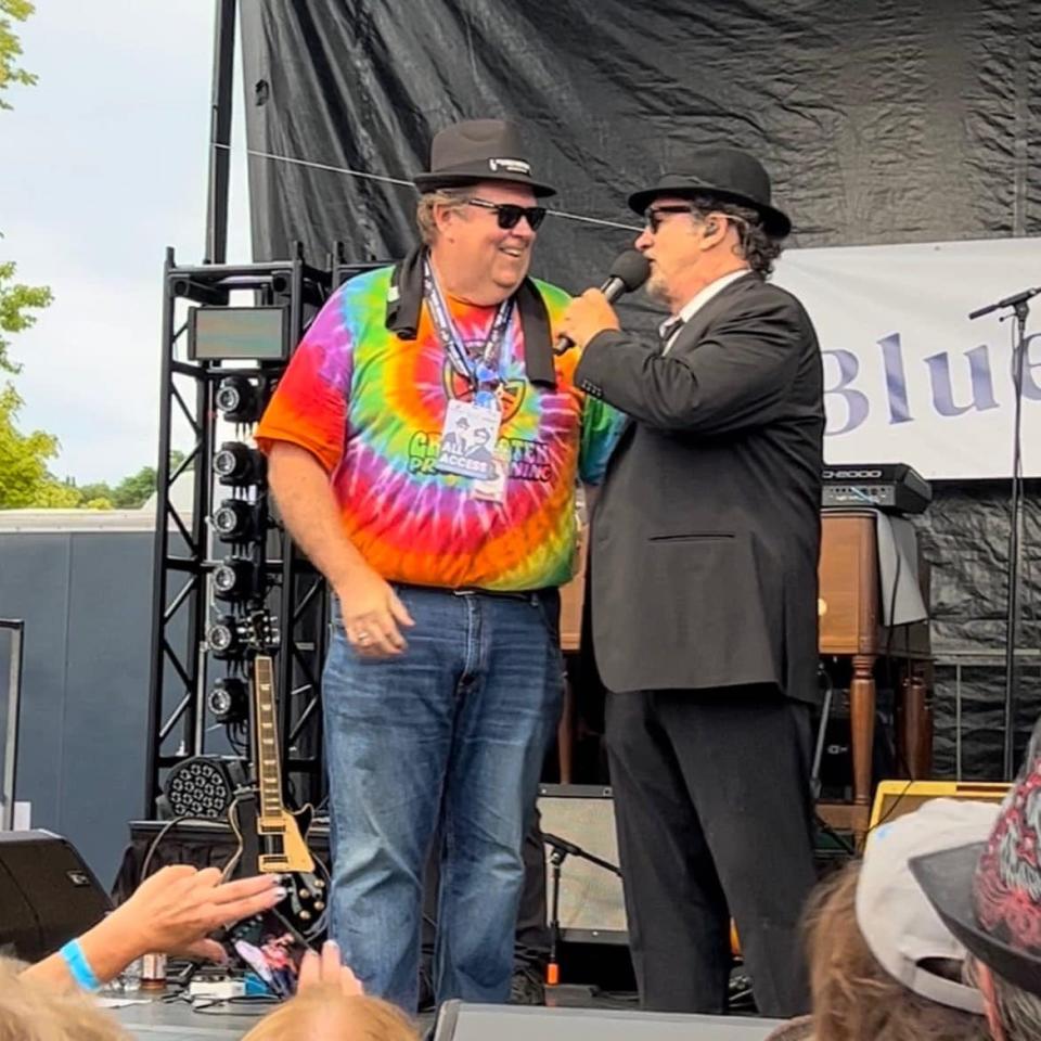 George Lynch of Green Stem in Niles joins Jim Belushi on stage during a cannabis music festival last summer.