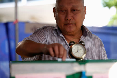 A voter casts his ballot in the general election at a polling station in Bangkok, Thailand, March 24, 2019. REUTERS/Soe Zeya Tun