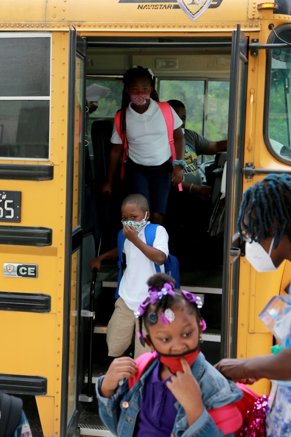 Savannah-Chatham students get off a school bus.