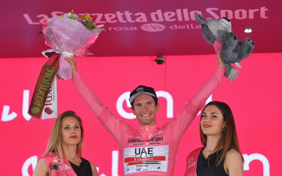 Jan Polanc celebrates on the podium after becoming the new race leader at the Giro d'Italia - 2019 Getty Images