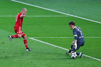 Arjen Robben of Bayern Muenchen scores a goal past Roman Weidenfeller of Borussia Dortmund during the UEFA Champions League final.