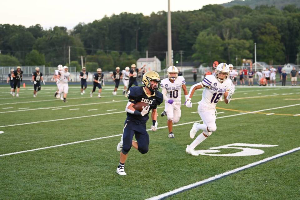 Bald Eagle Area’s Kahale Burns runs with the ball during the first game of the season, against Bishop Guilfoyle, on Friday, Aug. 25, 2023. The Eagles won, 17-7.