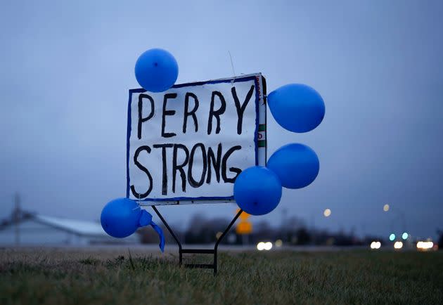 A sign along Highway 141 in Granger, Iowa, shows support for the neighboring community of Perry on Jan. 5, following a shooting at the Perry Middle School and High School building the previous day. 