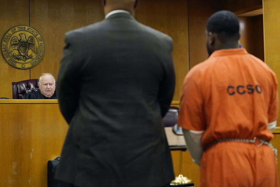 Marquis Aaron Flowers, 28, right, and his attorney Kelsey Rushing, left, listen as Special Judge Richard "Dickie" McKenzie, sentenced Flowers to two life sentences for the 2018 murder of two Brookhaven police officers in Lincoln County Circuit Court, moments after pleading guilty to first degree murder in their deaths, Wednesday morning, Nov. 3, 2021, in Brookhaven, Miss. (AP Photo/Rogelio V. Solis)