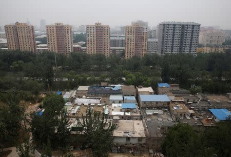 A cluster of buildings (front) where some patients and their family members stay while seeking medical treatments is seen in Beijing, China, June 23, 2016. REUTERS/Kim Kyung-Hoon