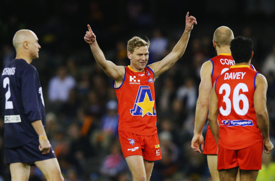 MELBOURNE, AUSTRALIA - SEPTEMBER 02: Kane Cornes celebrates a goal during the EJ Whitten Legends match at Etihad Stadium on September 2, 2016 in Melbourne, Australia.  (Photo by Michael Dodge/Getty Images)