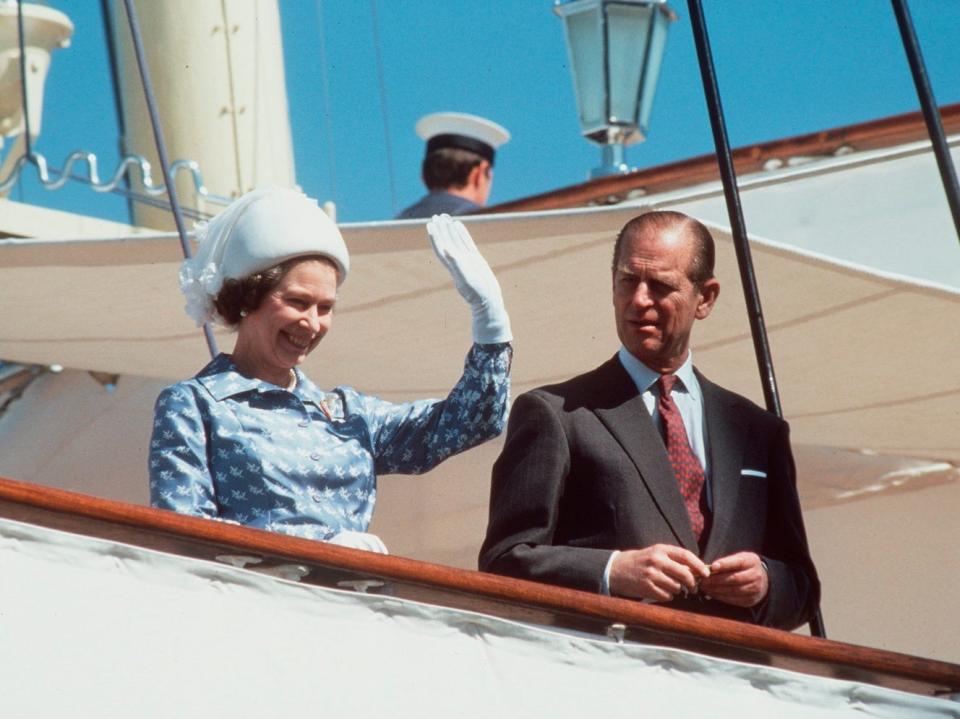 The Queen And Prince Philip waving on board the Royal Yacht Britannia during an official visit to Kuwait during the tour of the Gulf in 1979.