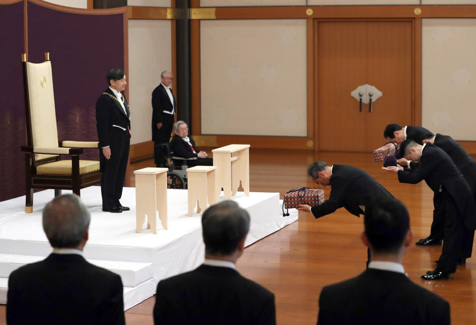 Japan's new Emperor Naruhito receives the Imperial regalia of sword and jewel as proof of succession at the ceremony at Imperial Palace in Tokyo, Wednesday, May 1, 2019. (Japan Pool via AP)