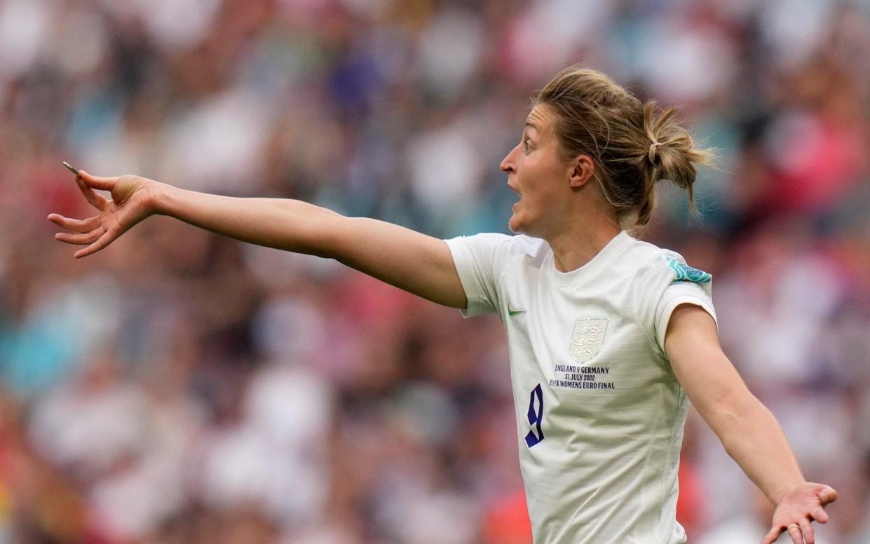 England's Ellen White shows an object picked up from the pitch to the referee during the Women's Euro 2022 final soccer match between England and Germany at Wembley stadium in London, Sunday, July 31, 2022 - AP
