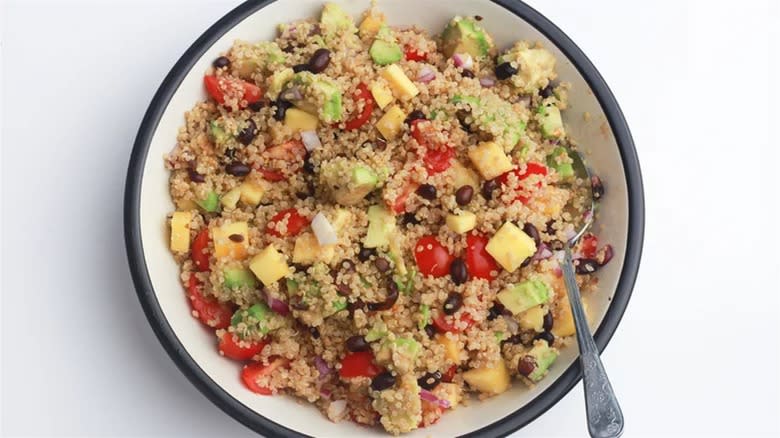 Mango quinoa salad in white bowl